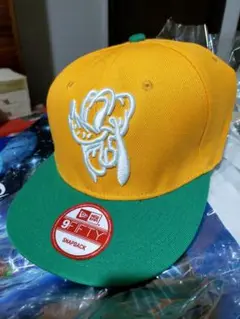 9FIFTY スナップバックキャップ オレンジ/グリーン　プルート
