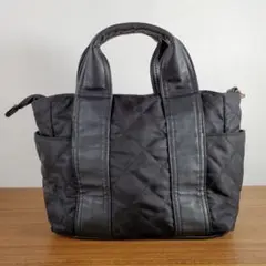 anyFAM キルティング ミニバッグ 黒×ゴールド 手持ち 異素材 底鋲付き