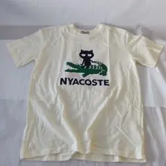 おもしろtシャツ　ニャコステ　メンズL　半袖Tシャツ　クリーム　nyacoste