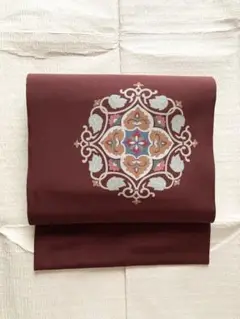美品 正絹 名古屋帯 塩瀬 染め帯 華紋模様 茶色 赤茶 ブラウン 唐草 花唐草