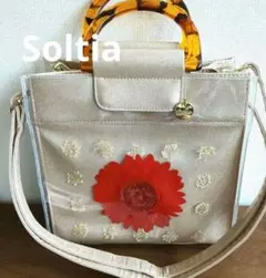 Soltia2wayバッグ シャンパンゴールド　レッド押し花柄 チャーム付き