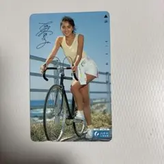 自転車に乗る美女未使用テレカ