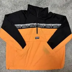 adidas ハーフネック ナイロンジャケット オレンジ/ブラック