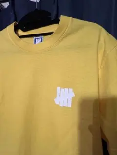 UNDEFEATED 黄色　Tシャツ