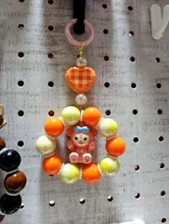 8、ハンドメイド オレンジくまちゃんの携帯ストラップ