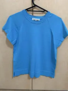 青いニットトップス 半袖 ラグラン