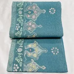 くすみのある水色に花柄の洒落帯 着物 袋帯