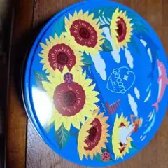 ひまわりデザインの金属製円形缶