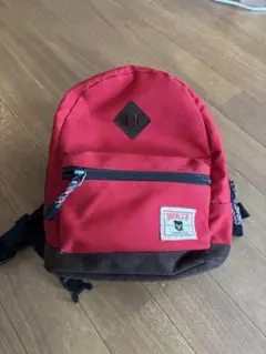 赤とブラウンのキャンバスリュック