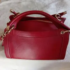 美品グーコミューン ショルダーバッグ タッセル付き