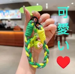 可愛い❤️dスマホストラップ 緑と黄色 編み込み キャラクターチャーム付き