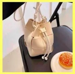 NICOLE&DORIS 斜めがけバッグ　編み込み巾着　アイボリー