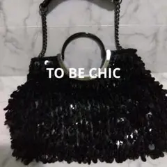 ビーズ装飾の黒いパーティーバッグ