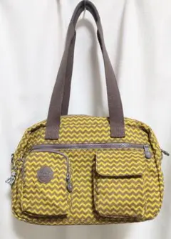 キプリング・kipling・イエロー×ブラウン・ジグザグ模様のショルダーバッグ