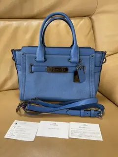 COACH青色ハンドバッグ ショルダーストラップ付き