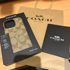 【新品未使用】 COACH iPhone 15PROスマホケース シグネチャー