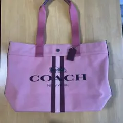 COACH・ピンク・ストライプ・キャンパストートバッグ。
