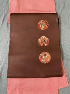 美品 正絹 袋帯 丸文に四季の花 小豆色 ワインカラー
