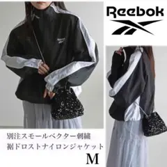 【Reebok】 別注スモールベクター刺繍裾ドロストナイロンジャケット 黒 M