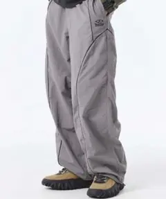 TRAVEL Nylon Curved Piping Line Pants
