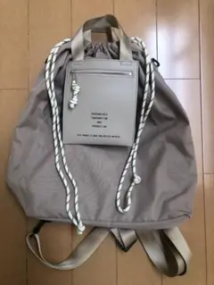 ベージュ ドローストリングリュック
