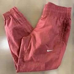 NIKE ナイロンパンツ スウォッシュ リフレクター 古着 オレンジ XSサイズ
