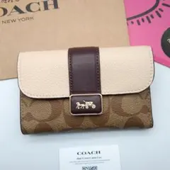 新作 新品 COACH 折り財布