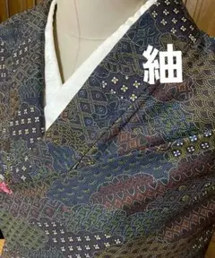 紬 黒紅烏羽色古典柄盛沢山