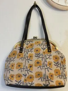 値下げSouvenir Gallery OTARU 黄色デイジー柄のがま口バッグ