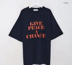 NUGU オレンジレタリング半袖Tシャツ