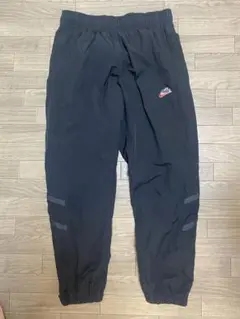 NIKE ウーブン ナイロンパンツ 筆記体ロゴ