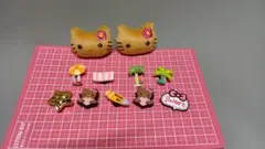 ハローキティ 日焼けキティクロックスパーツ　 チャーム　ジビッツ