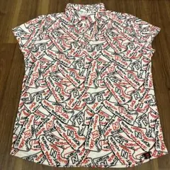 New Balance ロゴパターンシャツ