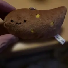 Qualia 笑顔の茶色いぬいぐるみ