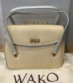 銀座WAKO ハンドバッグクリーム色金色のリボン金具 パーティーバッグ