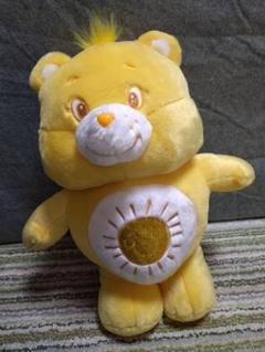 ケアベア™きらきらBIGぬいぐるみ４イエロー太陽柄