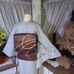 焦げ茶の地に立体感のある流線の刺繍が粋な、正絹開き名古屋帯です 焦げ茶の地に立体感のある流線の刺繍が粋な、正絹開き名古屋帯