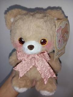 ベージュのぬいぐるみ ピンクリボン付き