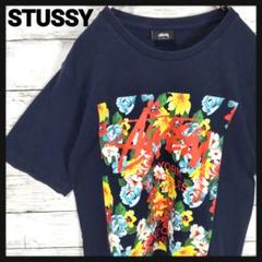 【人気モデル】ステューシー　花柄ワールドツアーTシャツ　ストックロゴ　ネイビー