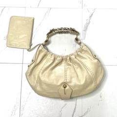 Yves Saint Laurent モンバサ メタルハンドル ポーチ付き 金