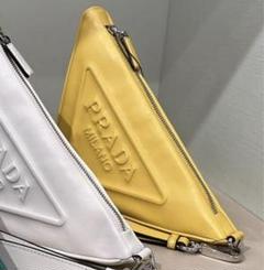 お値引きしました！PRADA トライアングルロゴポーチイエロー 新品 お値引きしました！PRADA トライアングルロゴポーチイエロー 新品