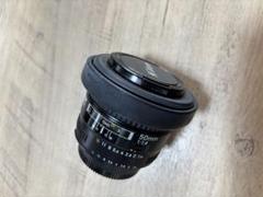 Nikon 50mm f/1.4 レンズキャップ付きのサムネイル