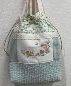 持ち歩けるヌビキルトを用いた巾着袋&ヴェロニクさんのクロスステッチ刺繍つき