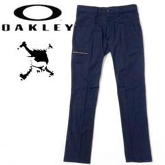 サイズ：36 OAKLEY オークリー  3Dテーパードストレッチパンツ スカル刺繍  ブルー系 [240101426590] ゴルフウェア メンズ ストスト OAKLEY オークリー 3Dテーパードストレッチパンツ スカル刺繍