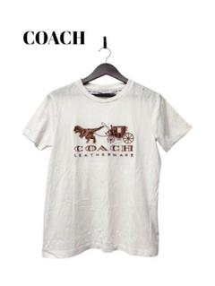 コーチ“真っ白”な25年春メンズウェア、恐竜「レキシー」Tシャツ