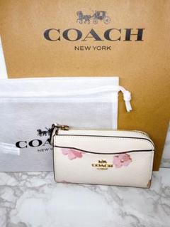 新品、未使用品。COACH 花柄フラグメントケース