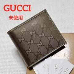 未使用GUCCI グッチ　レザー二つ折り財布　インプリメ　ブロンズ　箱カード付き