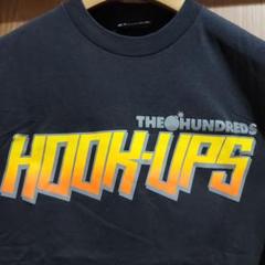 ハンドレッツ ロゴ HOOKUPS フックアップ スケーター Tシャツ 古着のサムネイル