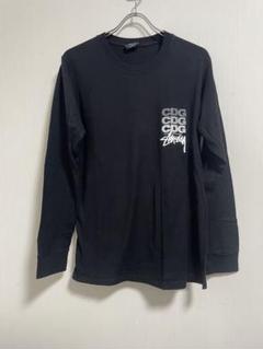 CDG×Stussy ロゴ ブラック 長袖Tシャツ - メルカリ