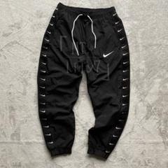 NIKE ラインロゴ トラックパンツ ブラック ホワイト スウッシュ M 新品】希少、ナイキ、NIKE、ジップパンツ、ウーブンパンツ、黒